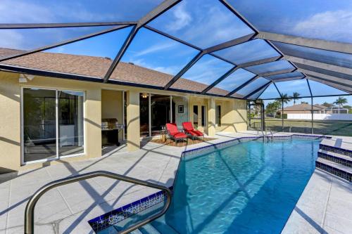 a swimming pool with a large glass roof at 1395 Marco Island in Marco Island
