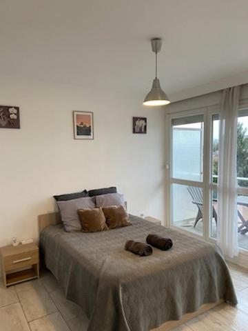 Postel nebo postele na pokoji v ubytování La plénitude Appt 124
