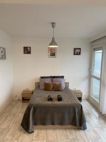Postel nebo postele na pokoji v ubytování La plénitude Appt 124