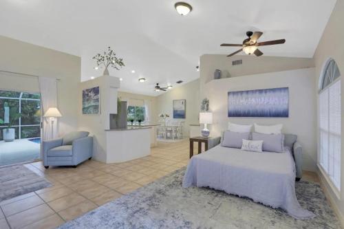a bedroom with a bed and a living room at 363 Marco Island in Marco Island