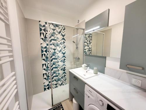 a bathroom with a sink and a shower at T2 Rénové avec Parking, près Port de Plaisance et Plage - Les Sables-d'Olonne - FR-1-92-929 in La Chaume