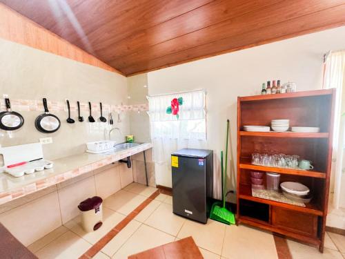 a kitchen with a counter and a refrigerator at Cottage Private Ensuite #2 in Monteverde Costa Rica