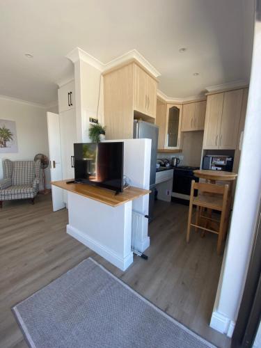 a kitchen with a counter top with a refrigerator at Castleton Unit 73 Plettenberg Bay in Plettenberg Bay