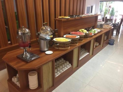 a buffet of food on display in a restaurant at Vientiane Garden Villa Hotel And Restaurant in Vientiane
