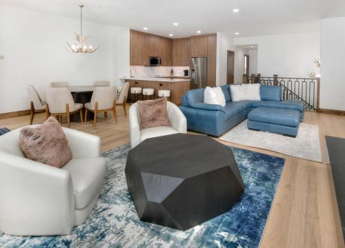a living room with a couch and a table at Highlands Slopeside #221 condo in Beaver Creek