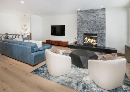 a living room with a couch and a fireplace at Highlands Slopeside #221 condo in Beaver Creek
