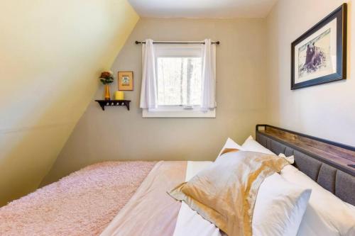 a bedroom with a bed and a window at All Points' End in Naples