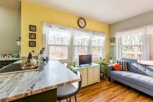 a kitchen and living room with a couch and a table at All Points' End in Naples