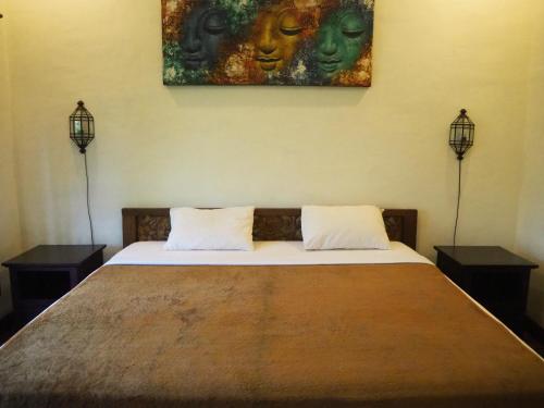 Postel nebo postele na pokoji v ubytování De'dalam two storey