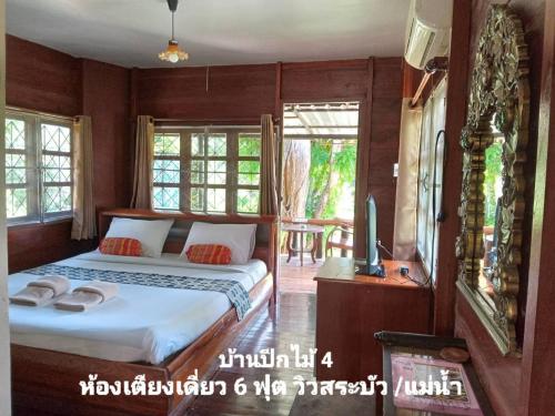 Postel nebo postele na pokoji v ubytování เรือนแฝด Brook view