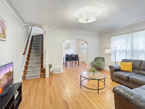 a living room with a couch and a table at 3 Br For 9 Guests -large Beautiful 3 Story Duplex in Des Moines