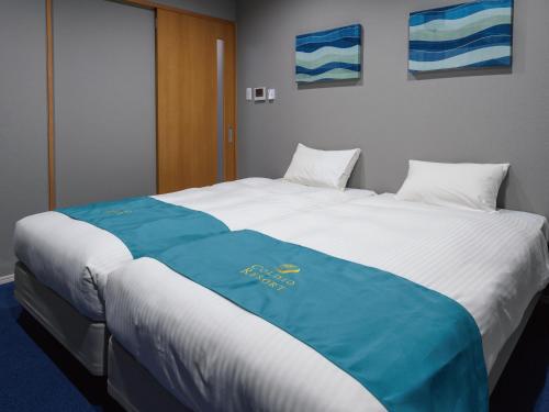 Postel nebo postele na pokoji v ubytování Condominium L's INN