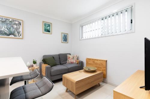 a living room with a couch and a table at New Listing! Air-Con and Well Presented! in Brisbane