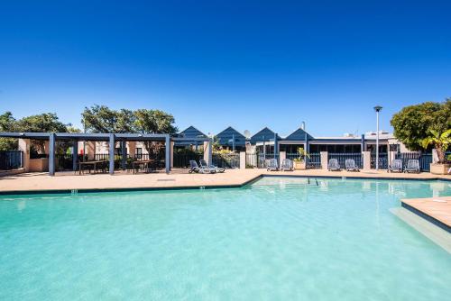 a large pool with blue water in a resort at Panorama at Margarets Beach in Gnarabup