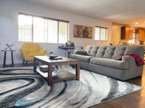 a living room with a couch and a coffee table at Modern Stay - Private Room in Long Beach