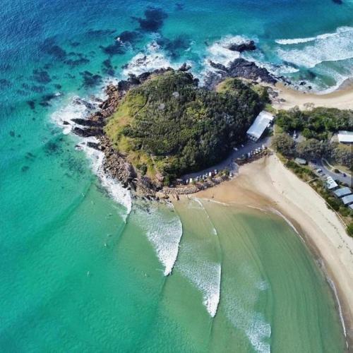 an aerial view of a small island in the ocean at Sunrise Villas by Charlesworth in Scotts Head