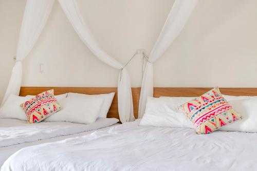 Postel nebo postele na pokoji v ubytování Pumori Guesthouse
