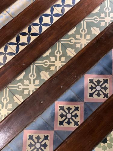 a ceiling of a room with patterns on the tiles at Mambo Hill Resort in Nusa Penida