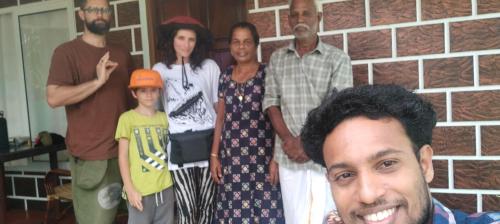 a group of people posing for a picture at Marari Red Angel in Mararikulam