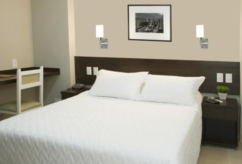 Katil atau katil-katil dalam bilik di Lider Hotel Ituiutaba