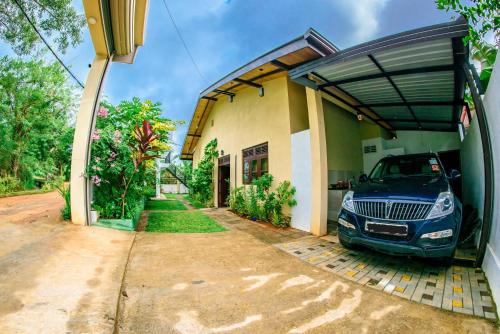 a car parked in the garage of a house at Aspirations Holiday Villas in Anuradhapura
