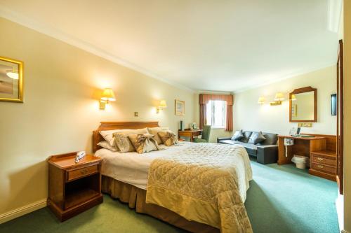 Arden Hotel And Leisure Club tesisinde bir odada yatak veya yataklar