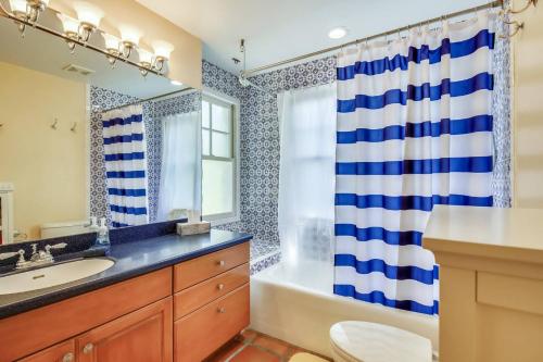 a bathroom with a sink and a tub and a shower at Cottage by the Pool by AvantStay w Balcony BBQ Shared Pool Month Long Stays Only in Stock Island