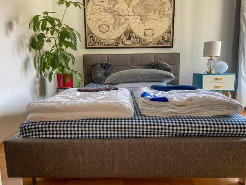 two mattresses sitting on a bed in a room at Beautiful bright apartment with balcony/10’ Mitte in Berlin
