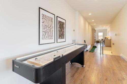 a large ping pong table in the middle of a room at Springsteen by AvantStay Stylish Townhouse in Nashville in Nashville