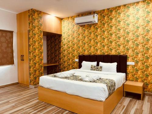 a bedroom with a large bed in a room at Hotel Park Airport Zone Hyderabad in Shamshabad