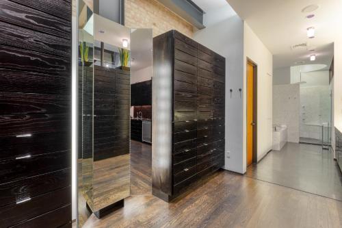 a hallway with a large wooden door in a house at Paramount Place by AvantStay 4 Story Apartment in Heart of Austin w Movie Theatre in Austin