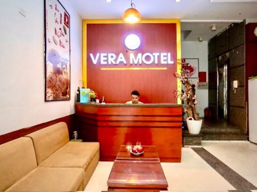 a man sitting at a vera model restaurant at Vera Hotel Hà Nội in Hanoi