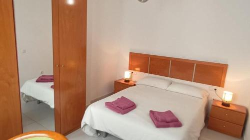 En eller flere senge i et værelse på Apartamento a orillas de la playa de Tarajalejo