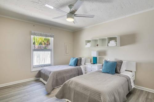 a bedroom with two beds and a ceiling fan at Flaglers Oasis by AvantStay Private Pool in Key West Month Long Stays Only in Key West