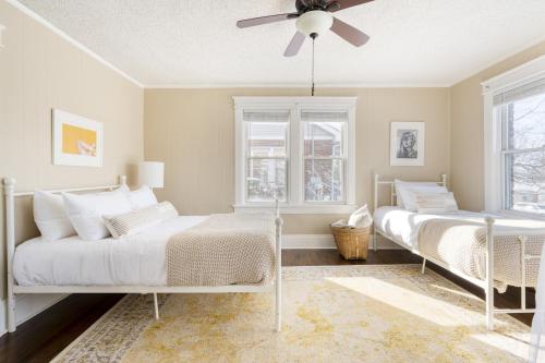 a bedroom with two beds and a ceiling fan at Louise by AvantStay Cute Nashville Home w Large Yard Firepit in Nashville