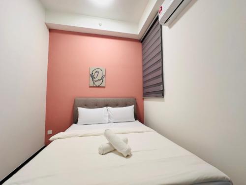 מיטה או מיטות בחדר ב-Urban Suites Homestay