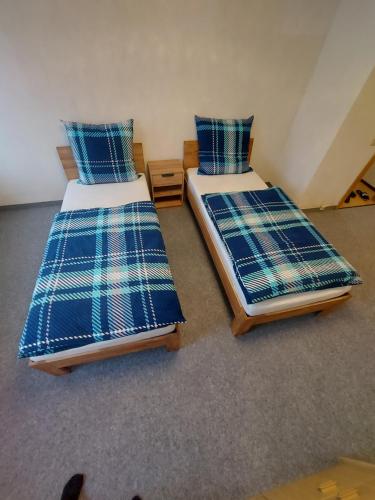 Łóżko lub łóżka w pokoju w obiekcie Selb Ferienwohnungen