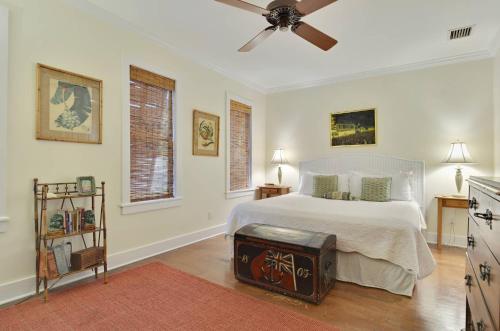 a bedroom with a bed and a ceiling fan at Amelia Home by AvantStay In Historic Old Town w Pool in Key West