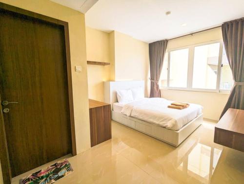 Ένα ή περισσότερα κρεβάτια σε δωμάτιο στο Lovina Spacious 12A-17 at Nagoya Thamrin