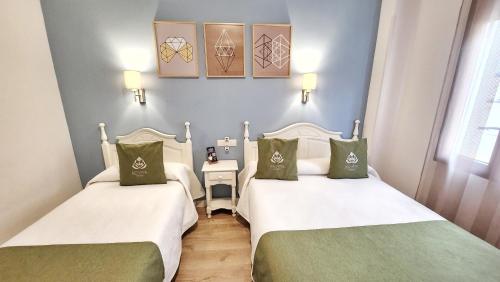 Letto o letti in una camera di Eco Hotel Toledo