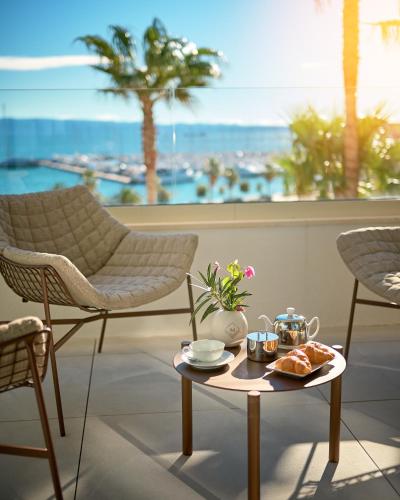 a table with a tray of food on top of a room at Mirari Boutique Hotel in Split