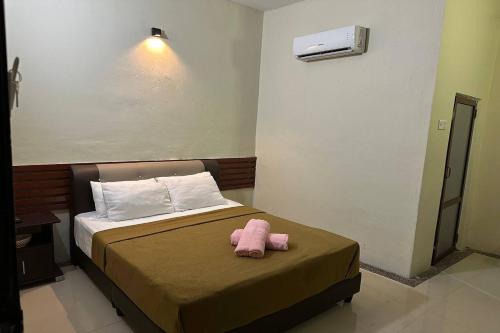 Cama o camas de una habitación en Bull & Bear Airport Hotel Langkawi