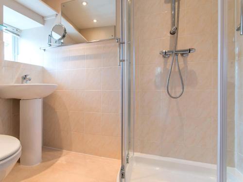 a bathroom with a shower and a sink at 1 bed in Brixham BX046 in Brixham