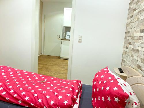 Postel nebo postele na pokoji v ubytování Ferienwohnungen Arp "Kleine Gärtnerei" mit Parkplatz