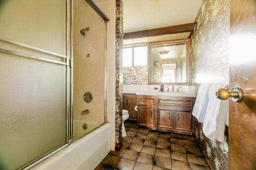 a bathroom with a shower and a toilet and a sink at Cliffridge by AvantStay Lush Malibu Hills Estate w Breathtaking Ocean Views in Malibu