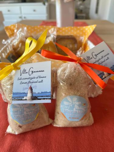 a group of bags of food on a table at Casa Vacanza Villa Giovanna in Valderice