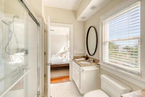 a bathroom with a shower and a sink and a mirror at Haven by AvantStay Luxury Beachfront Home w Pool Gorgeous Patios in Sullivans Island