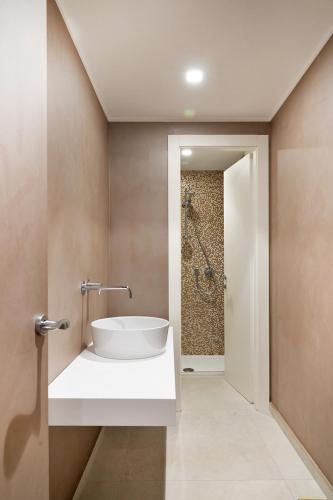 a bathroom with a sink and a shower at Hotel Edelweiss in Pescasseroli