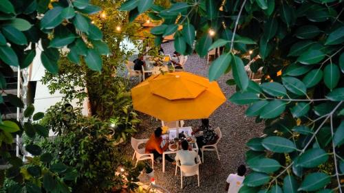 an overhead view of a patio with a yellow umbrella at Stay Banaras - A Boutique Hotel in Varanasi