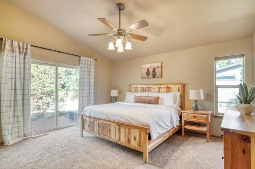 a bedroom with a bed and a ceiling fan at Black Bear Cabin by AvantStay Modern Bend Escape in Bend